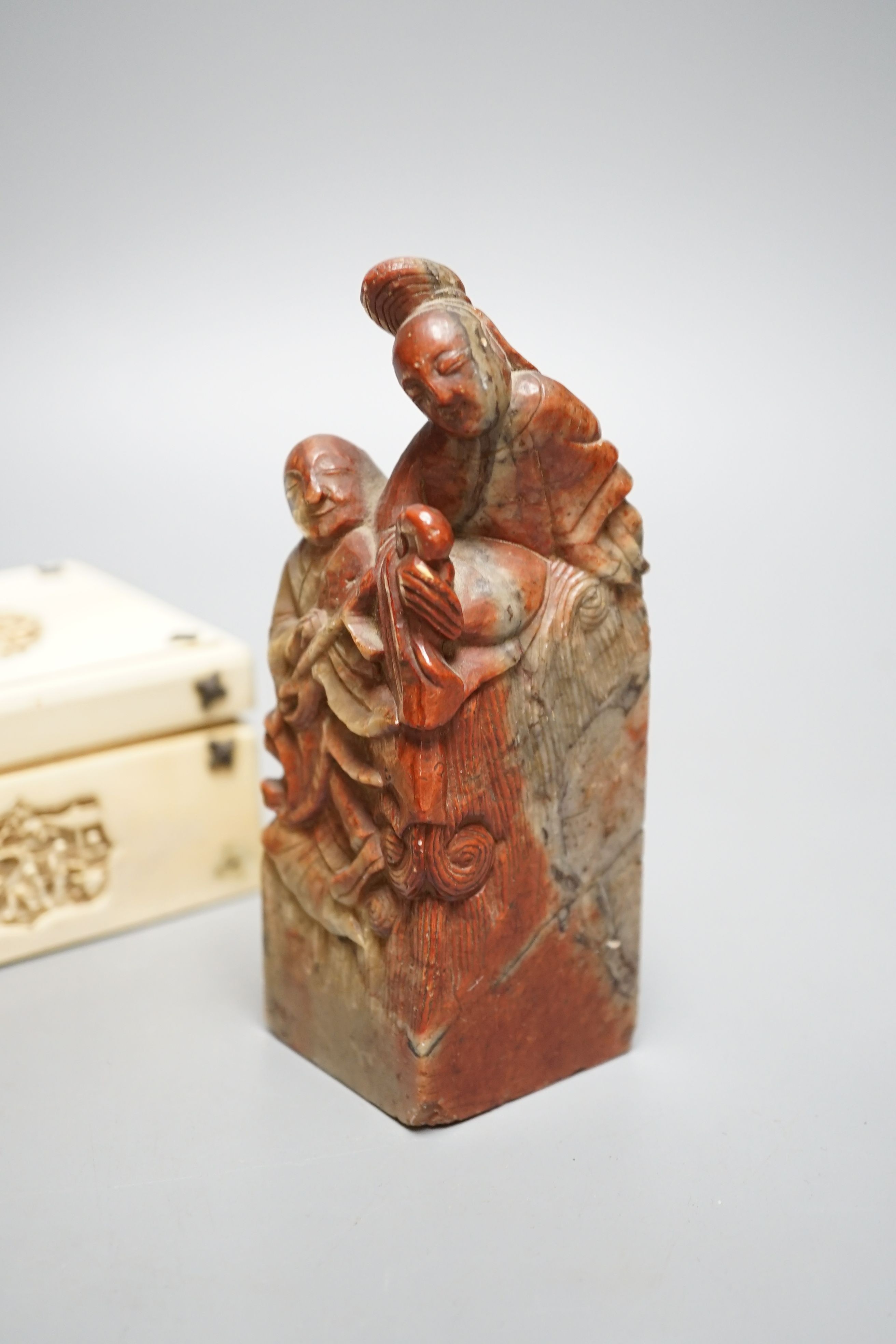 A decorative Chinese carved domino case and a soapstone figural seal (2)